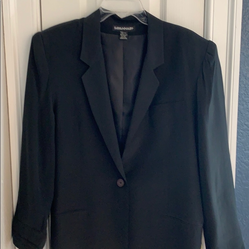 Savannah 100% silk blazer with polyester lining.
